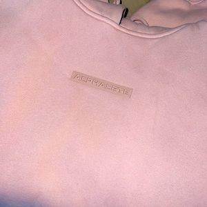 This is a men’s light pink alphalete sweatshirt.